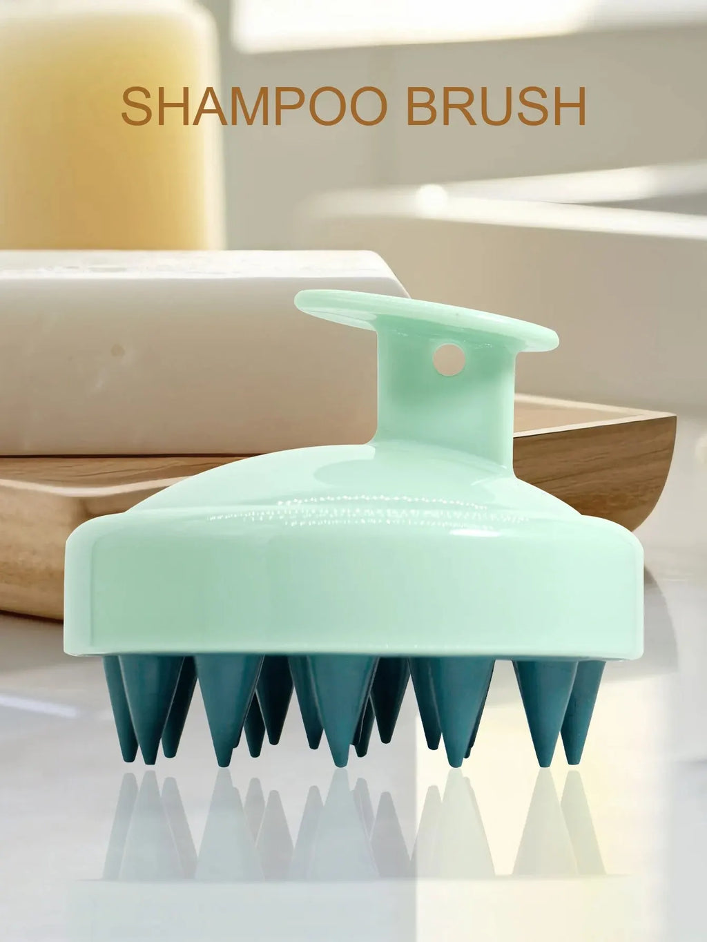 Silicone scalp massager shampoo brush on bathroom counter