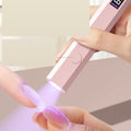 Flexible handheld UV nail lamp in use